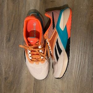 Like NEW coral / orange Reebok Nano size 10 women or 8.5 men